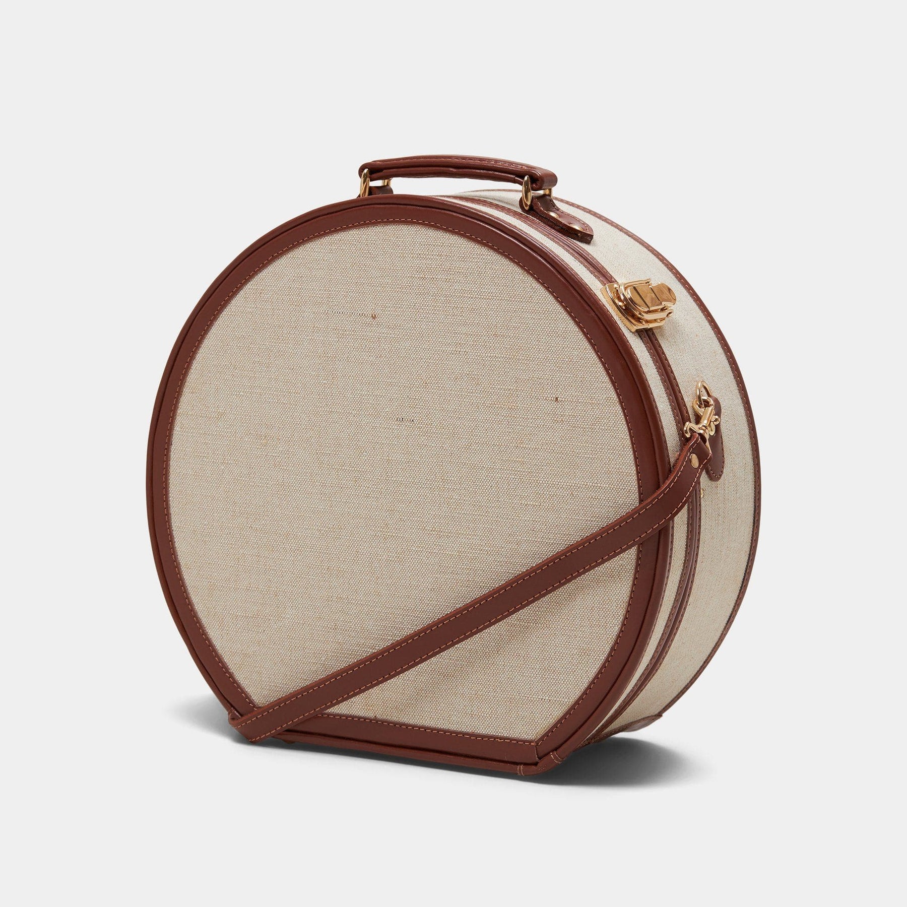 Angled product view of the large hatbox Editor linen suitcase with brown trims