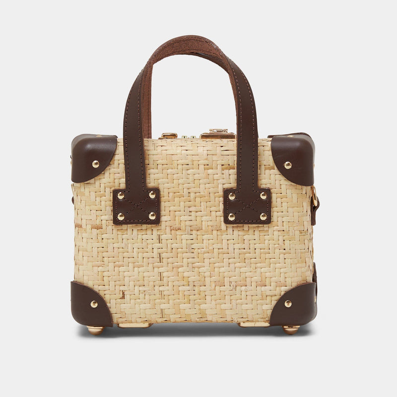 Back product view of the mini Explorer rattan suitcase in  natural wicker body and brown trims