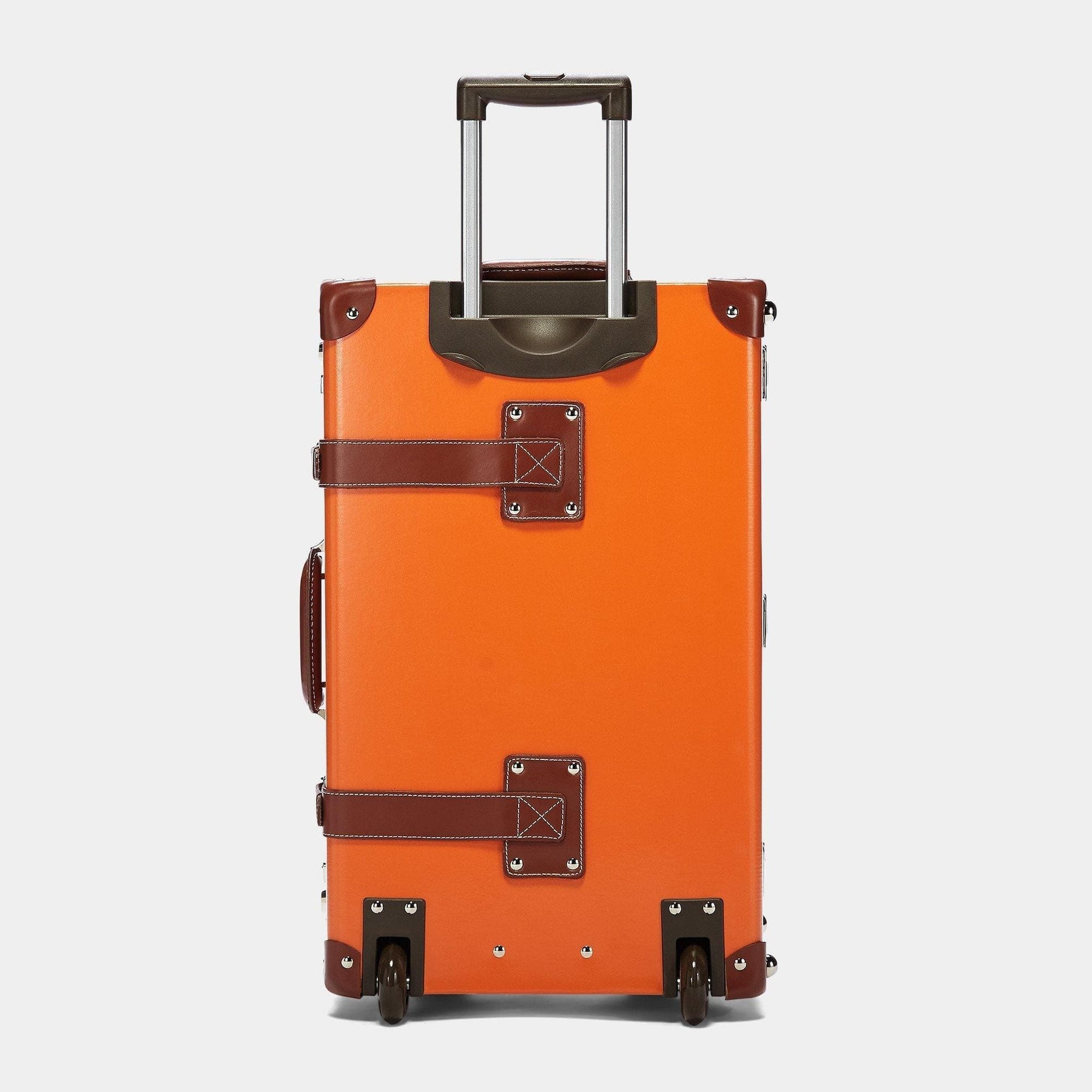 Back product view of the stowaway Anthropologist leather suitcase in orange with raised handle