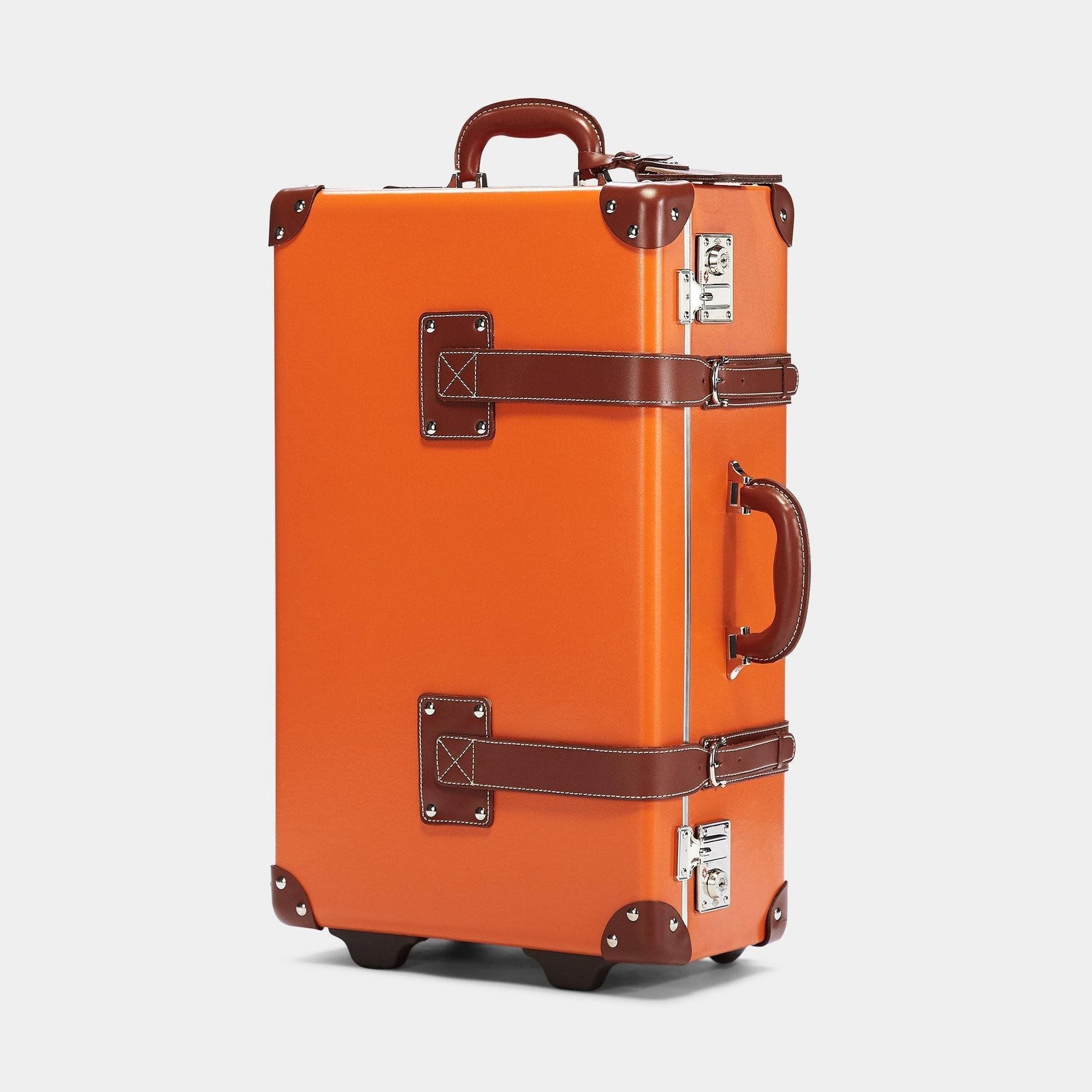 Angled product view of the stowaway Anthropologist leather suitcase in orange