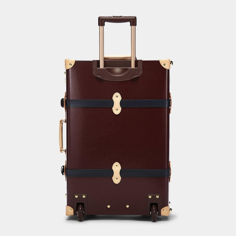 Back product view of the stowaway Architect leather suitcase in burgundy with raised handle
