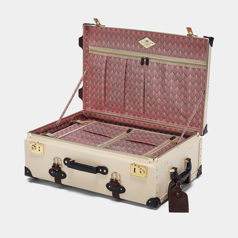 Open product view of the stowaway Architect leather suitcase in cream with art deco printed lining and brown leather luggage tag