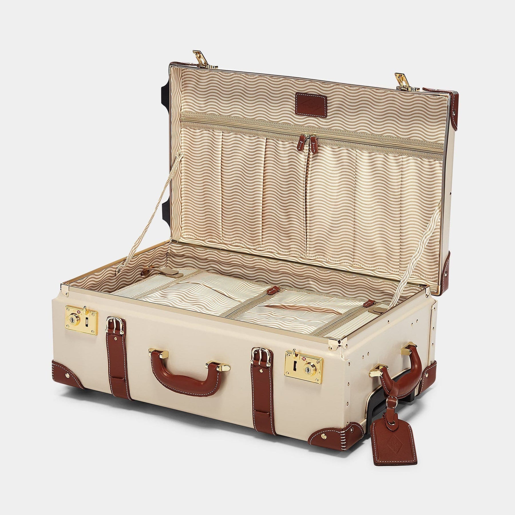 Open product view of the stowaway Diplomat leather suitcase in cream with snaffle-bit printed lining