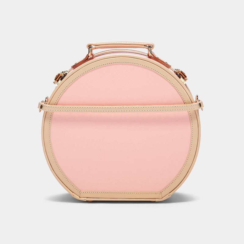 Product view of the small hatbox Correspondent fibreboard suitcase in pink with detachable suitcase strap