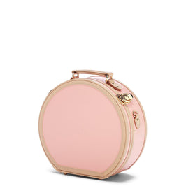 Angled product view of the small hatbox Correspondent fibreboard suitcase in pink