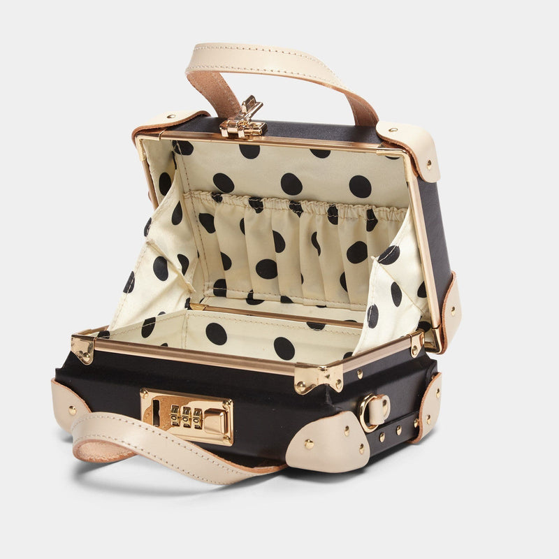 Open product view of the mini Starlet fibreboard suitcase in black with polka-dot printed lining