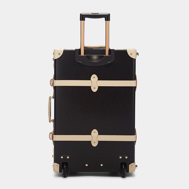 Back product view of the stowaway Starlet fibreboard suitcase in black with raised handle