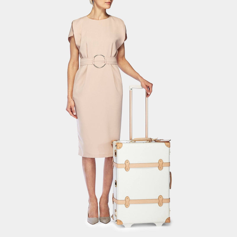 Model with the stowaway Sweetheart fibreboard suitcase in cream with raised handle