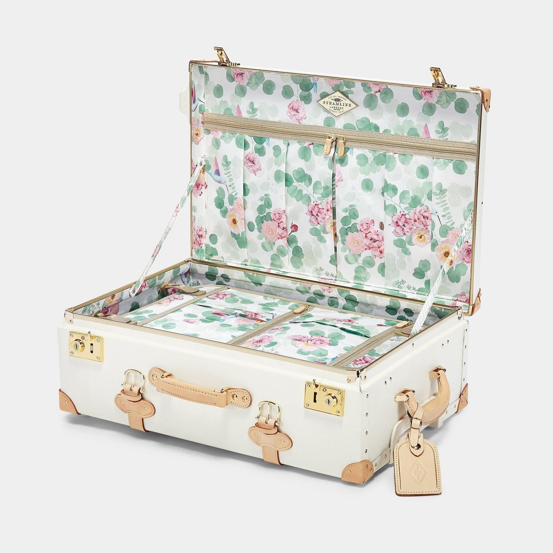 Open product view of the stowaway Sweetheart fibreboard suitcase in cream with botanical printed lining
