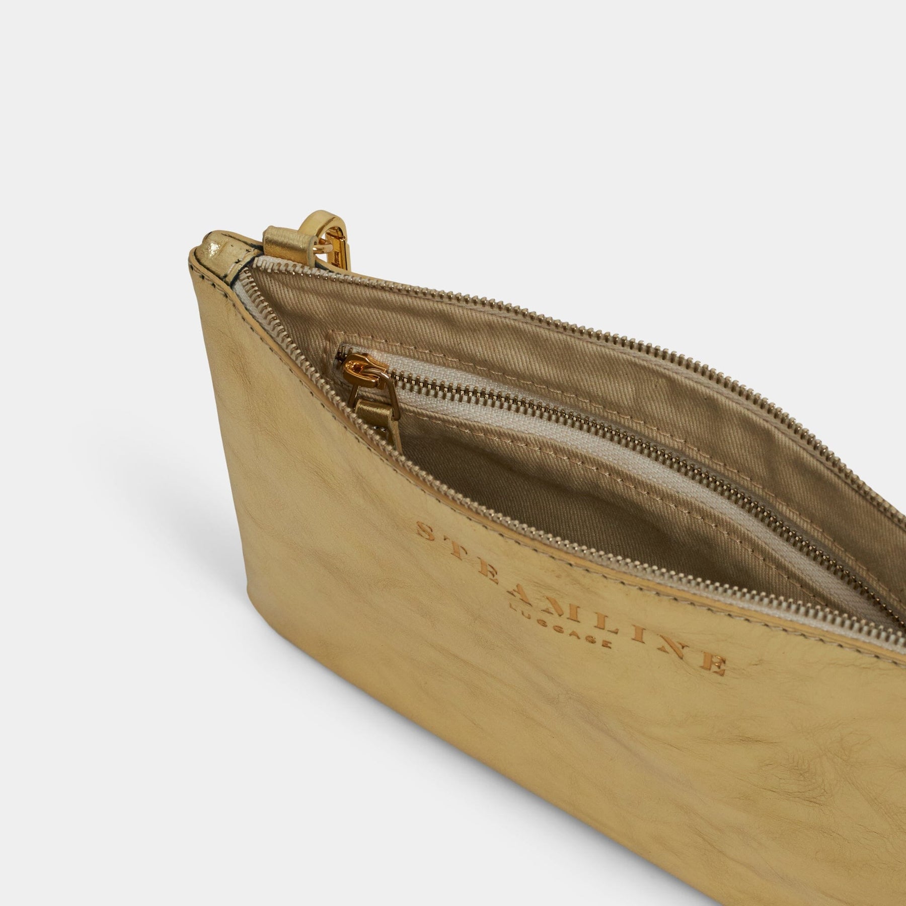 Open product view of the Navigator leather crossbody in gold with gold trims and ecru lining