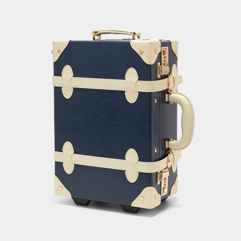 Angled product view of the kids carry-on Entrepreneur vegan leather suitcase in navy