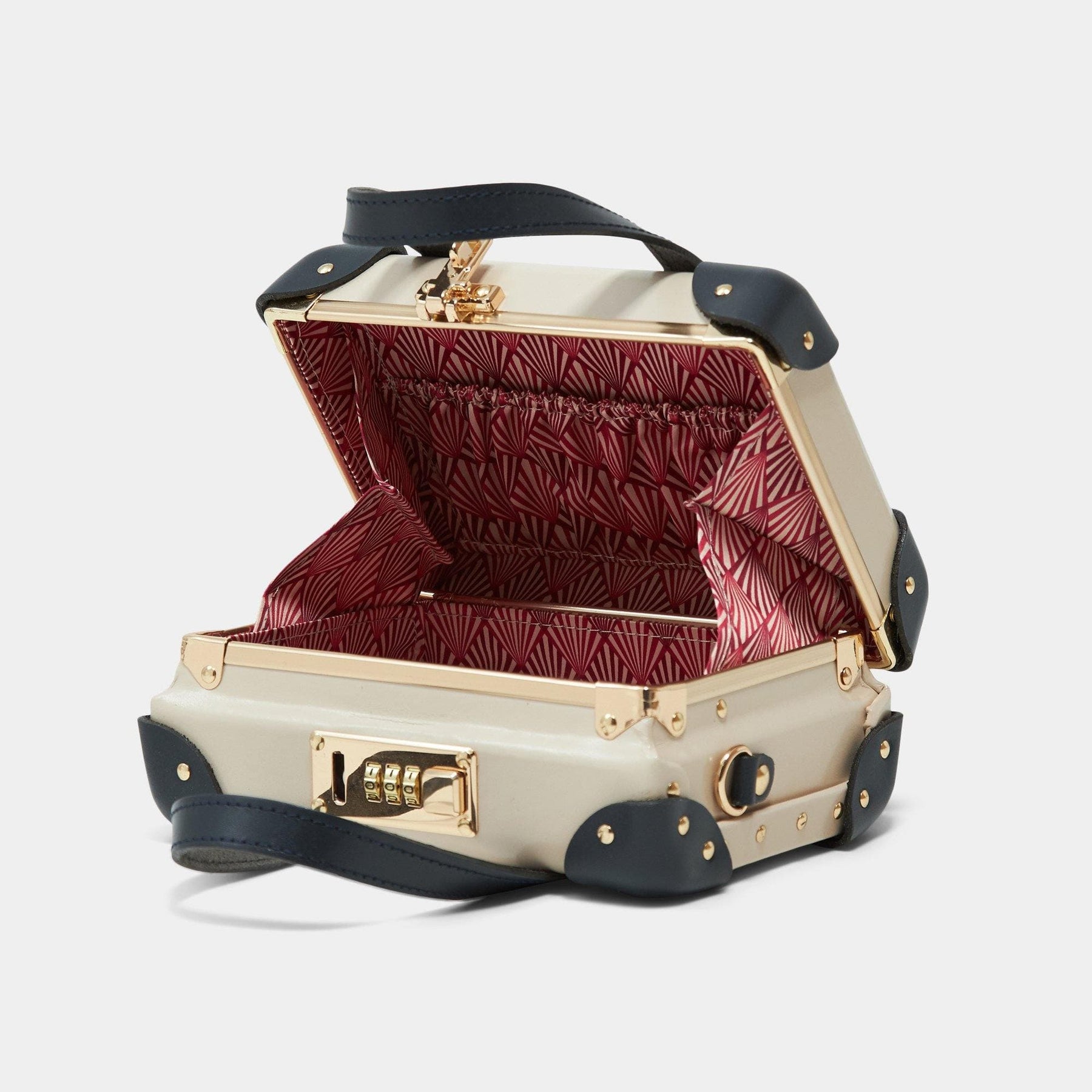 Open product view of the mini Architect leather suitcase in cream with art-deco printed lining