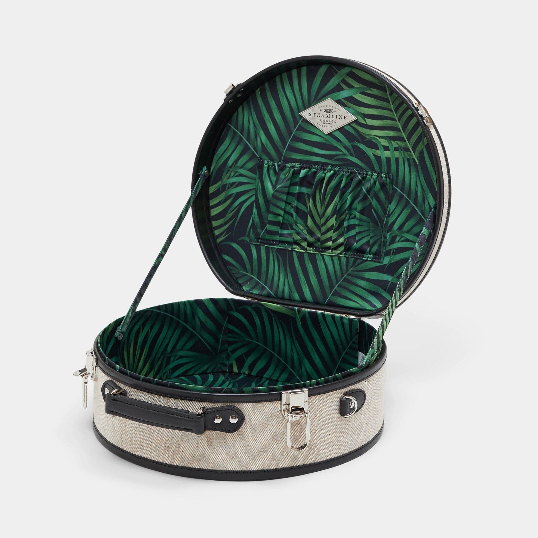 Open product view of the large hatbox Editor linen suitcase with black trims and palm-leaf print lining