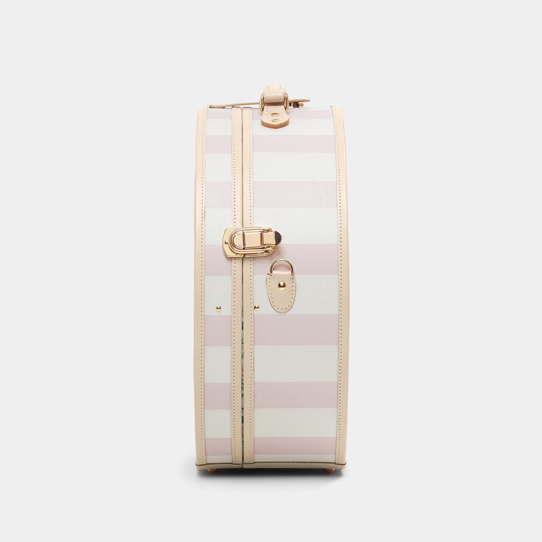 Side product view of the deluxe hatbox Illustrator fibreboard suitcase in pink-stripe with shoulder attachment strap