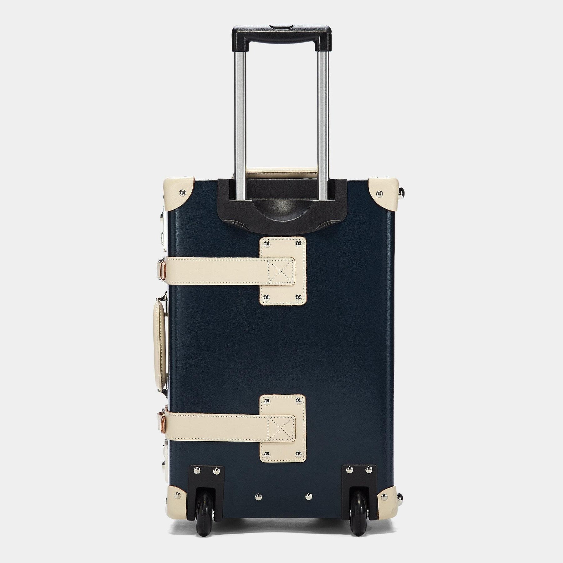 Back product view of the carry-on Anthropologist leather suitcase in navy with raised handle