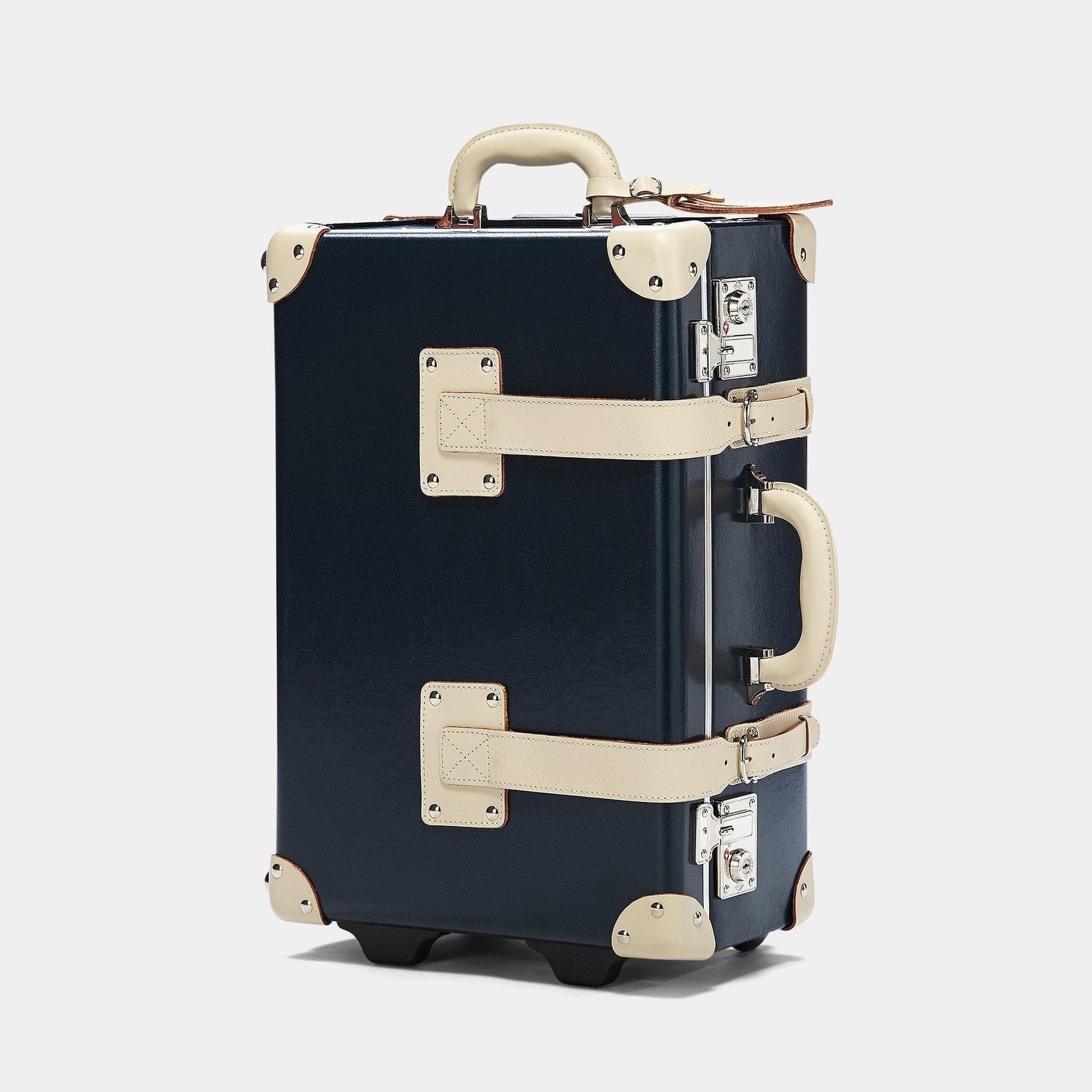 Angled product view of the carry-on Anthropologist leather suitcase in navy
