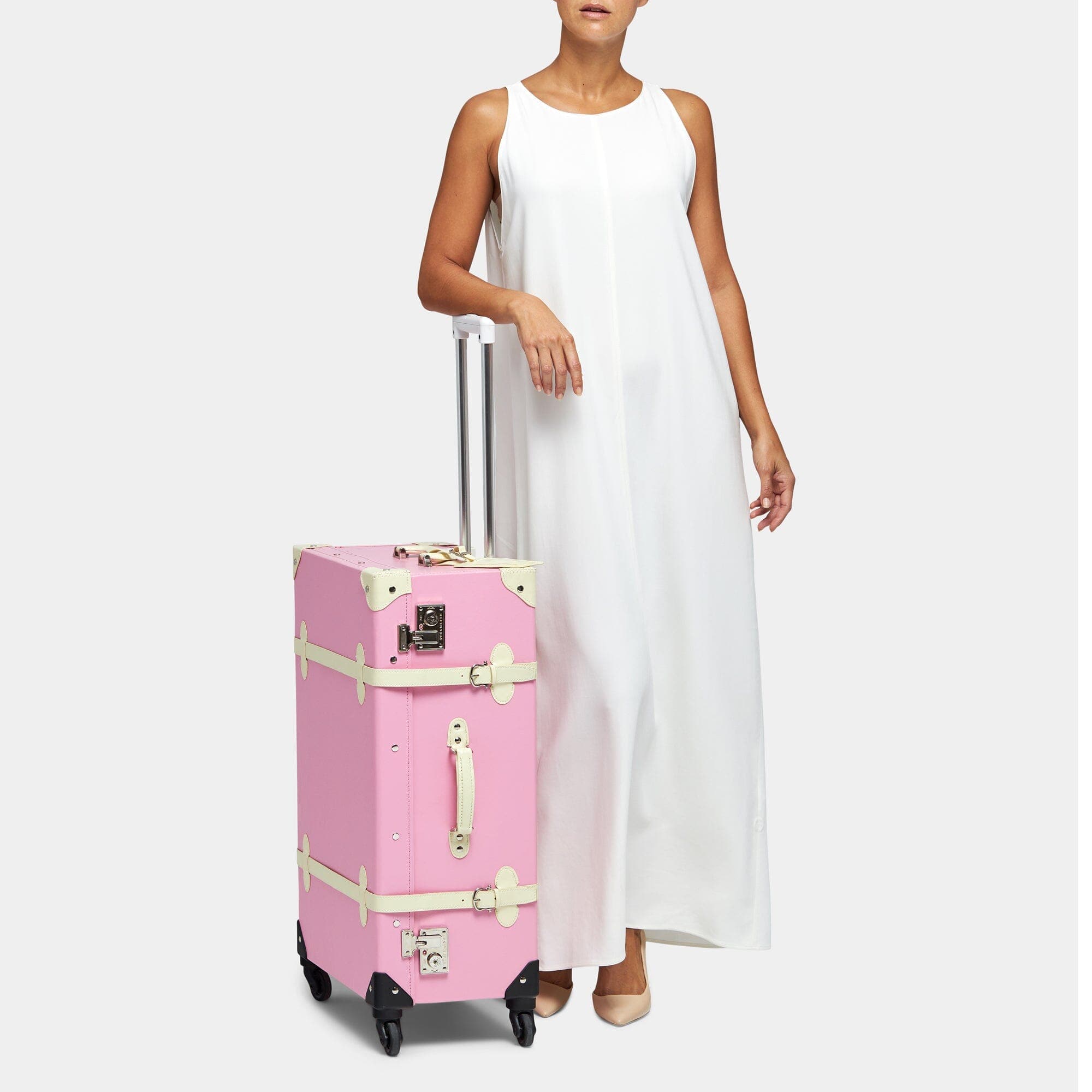 Shop our pink vegan-leather Spinner Check-In suitcase | SteamLine